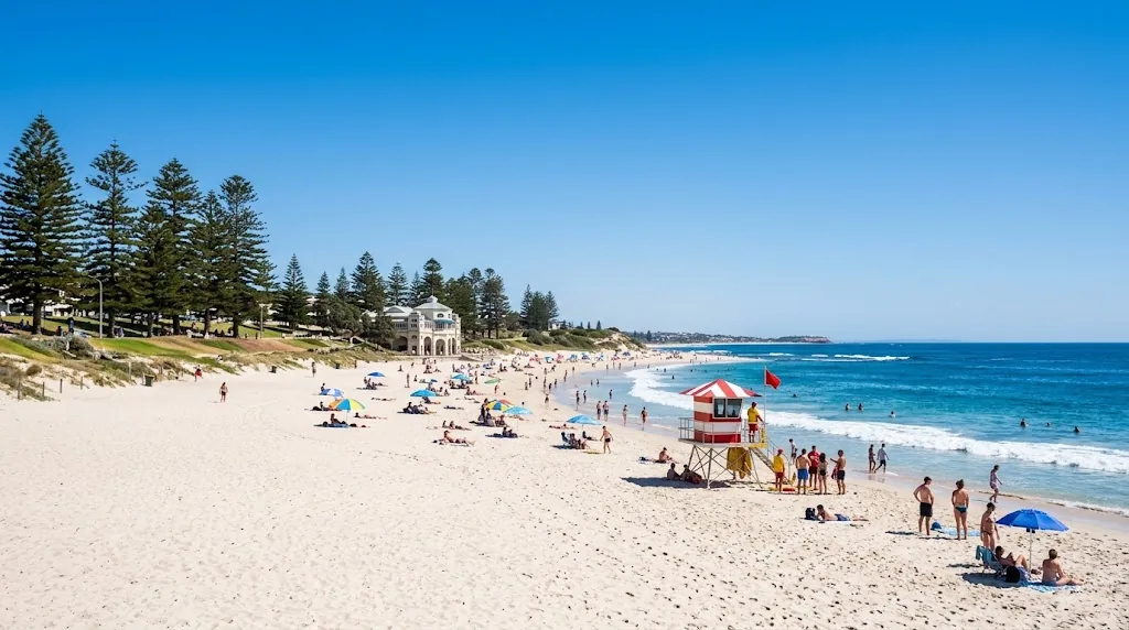 A wide sandy Perth beach under a cloudless December sky